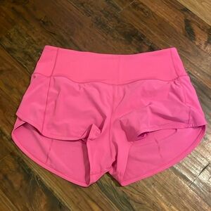 Lululemon speed ups in Sonic pink
